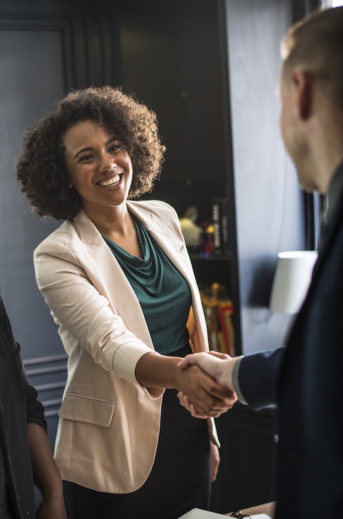 Business partners shaking hands in agreement